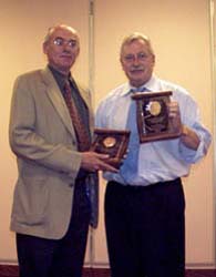 Bret Evans receiving a Presidental Award from Chuck Moore